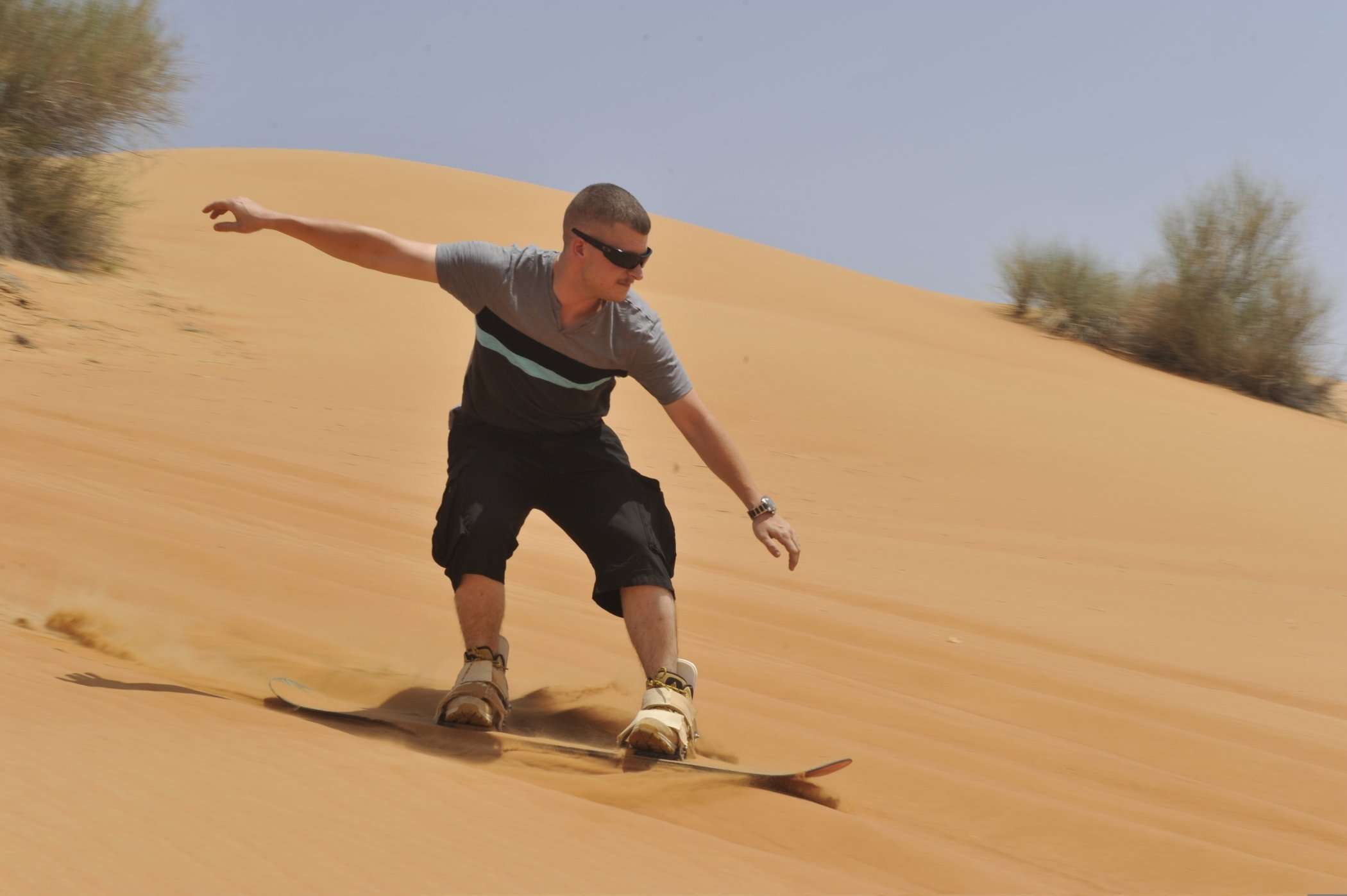 Sand surfing in the Dubai desert