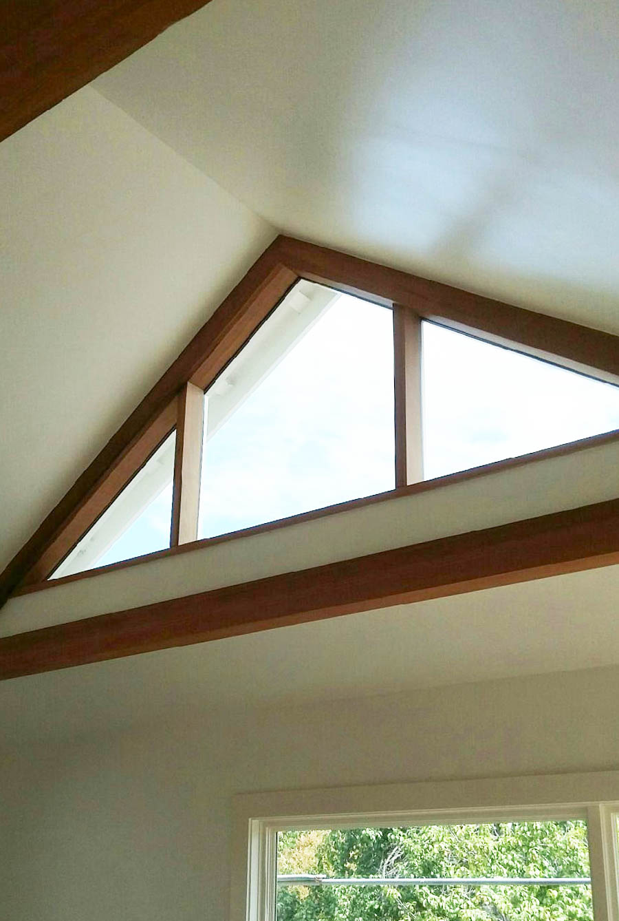 Vaulted Ceiling with Cedar Trusses and High Triangle Window deedsdesign