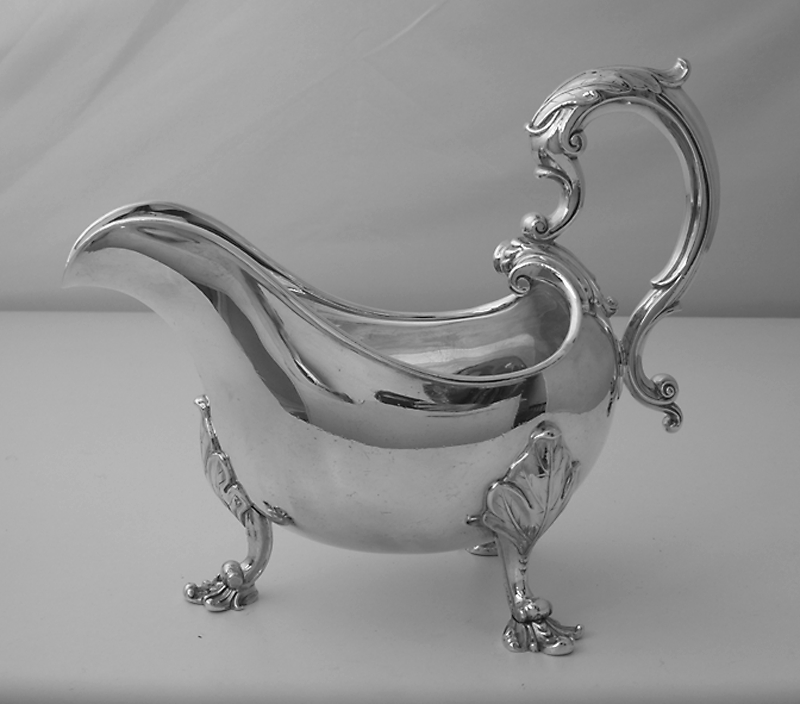 Antique silver sauceboats, papboats, cream pails and baskets