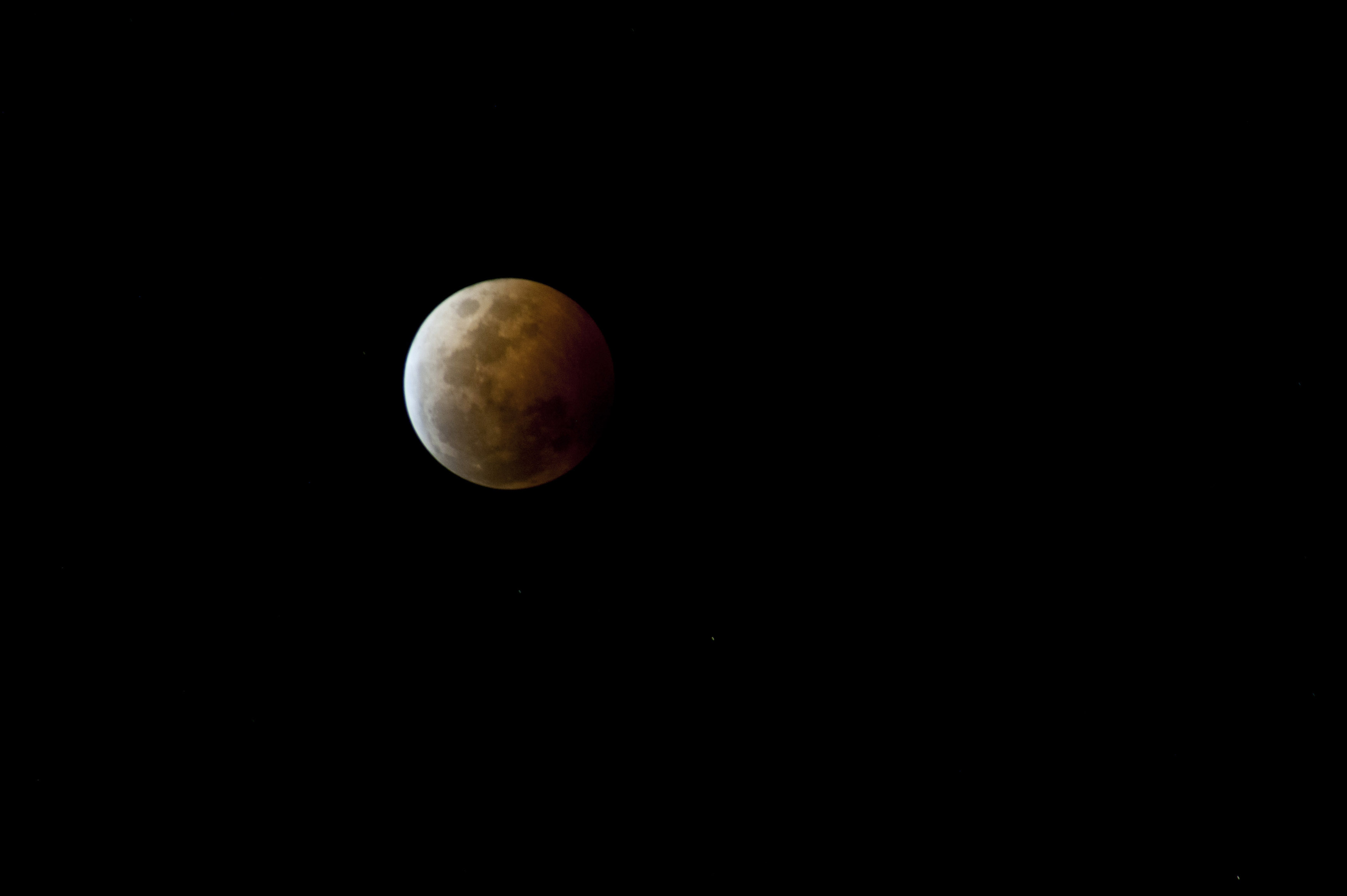 Free Stock image of Partially eclipsed moon in a dark sky
