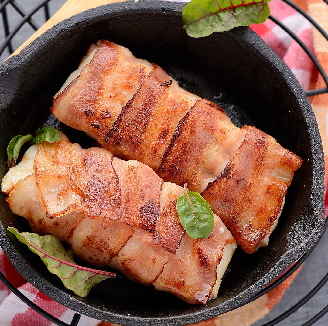 Bacon Wrapped Loin of Cod with Cheesy Beer Sauce and homemade chips