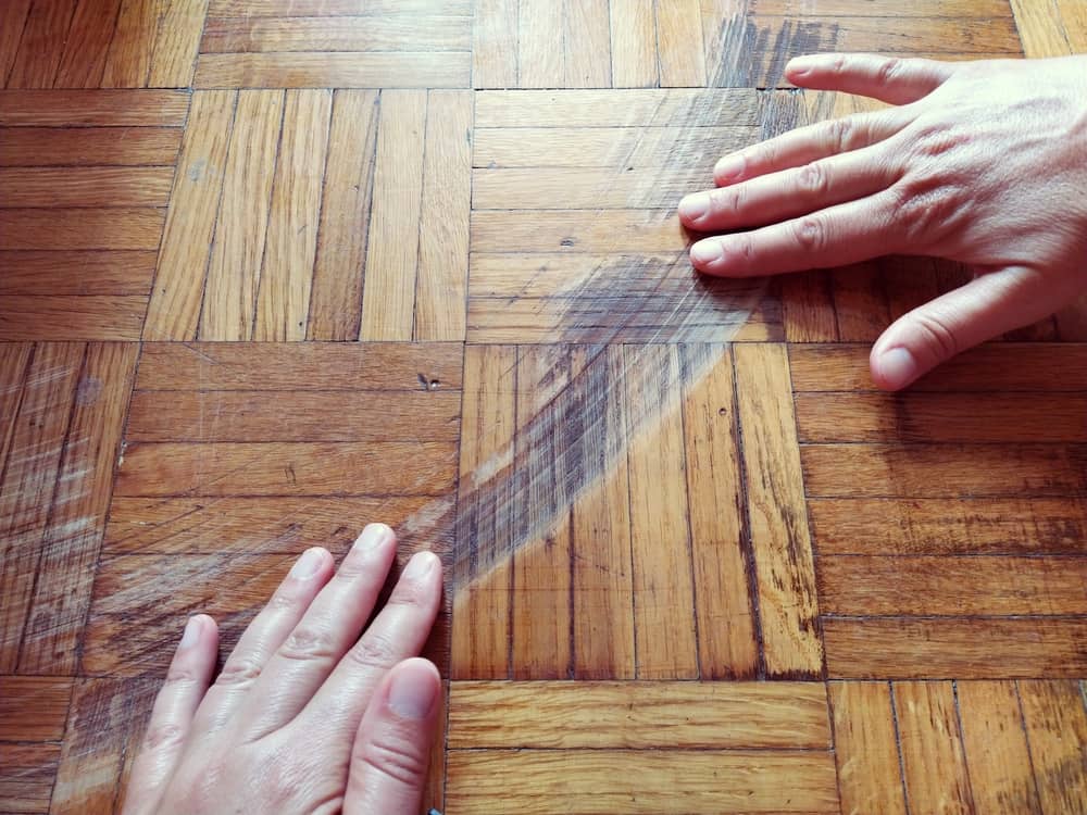 How to Fix Scratches On a Laminate Floor (And Replace a Plank)
