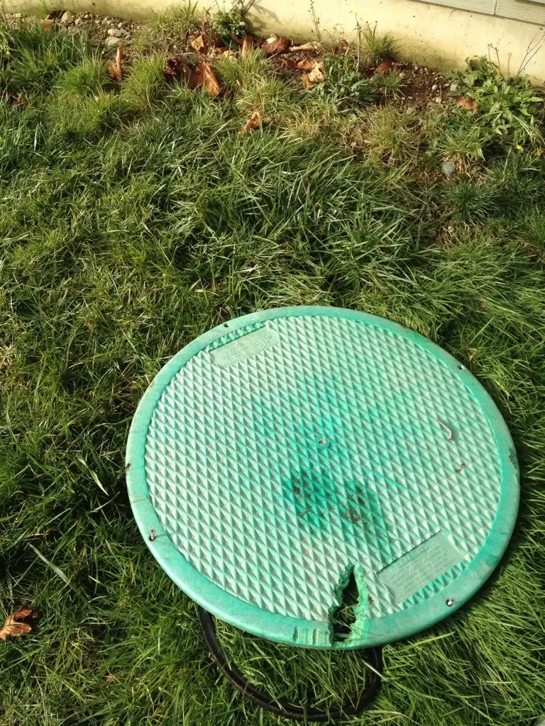 This is a common problem. Lid on the septic tank was damaged by a lawn