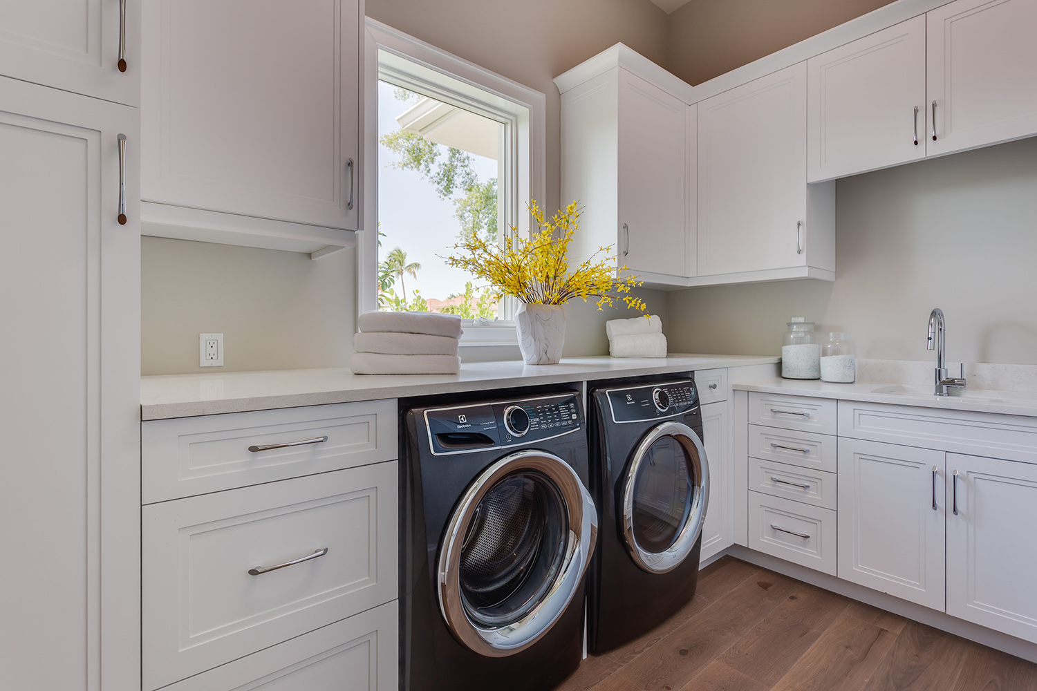 South Florida Design Laundry room with white upper and lower