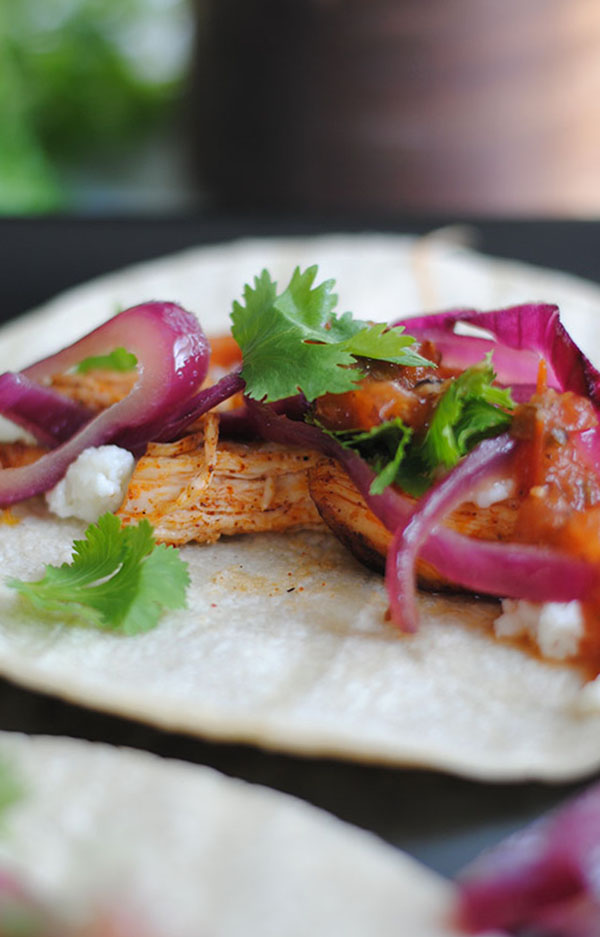 ancho chili chicken tacos with cider glazed red onions