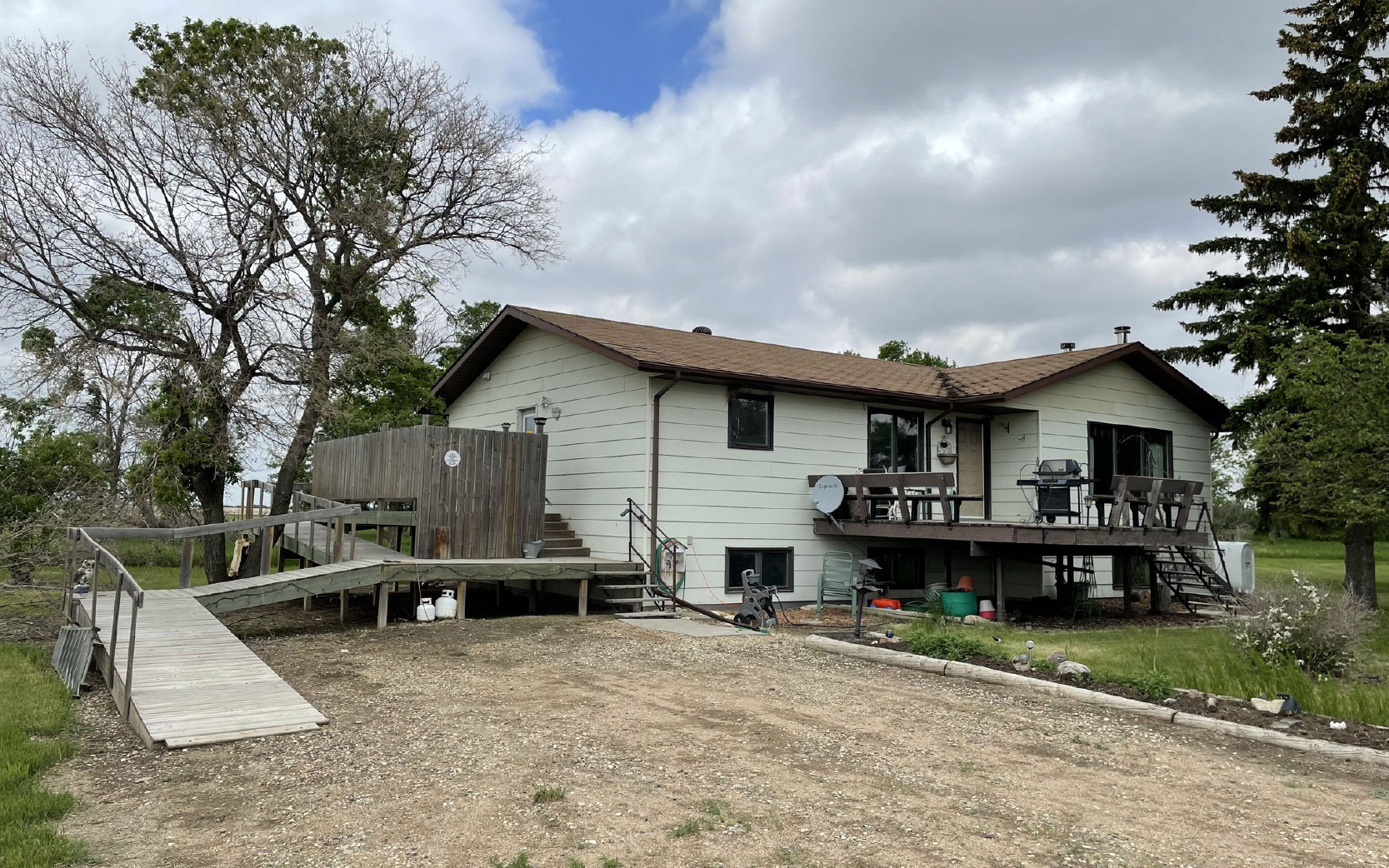 PRICE REDUCTION Secluded Bungalow on a Quarter Section of Land Near