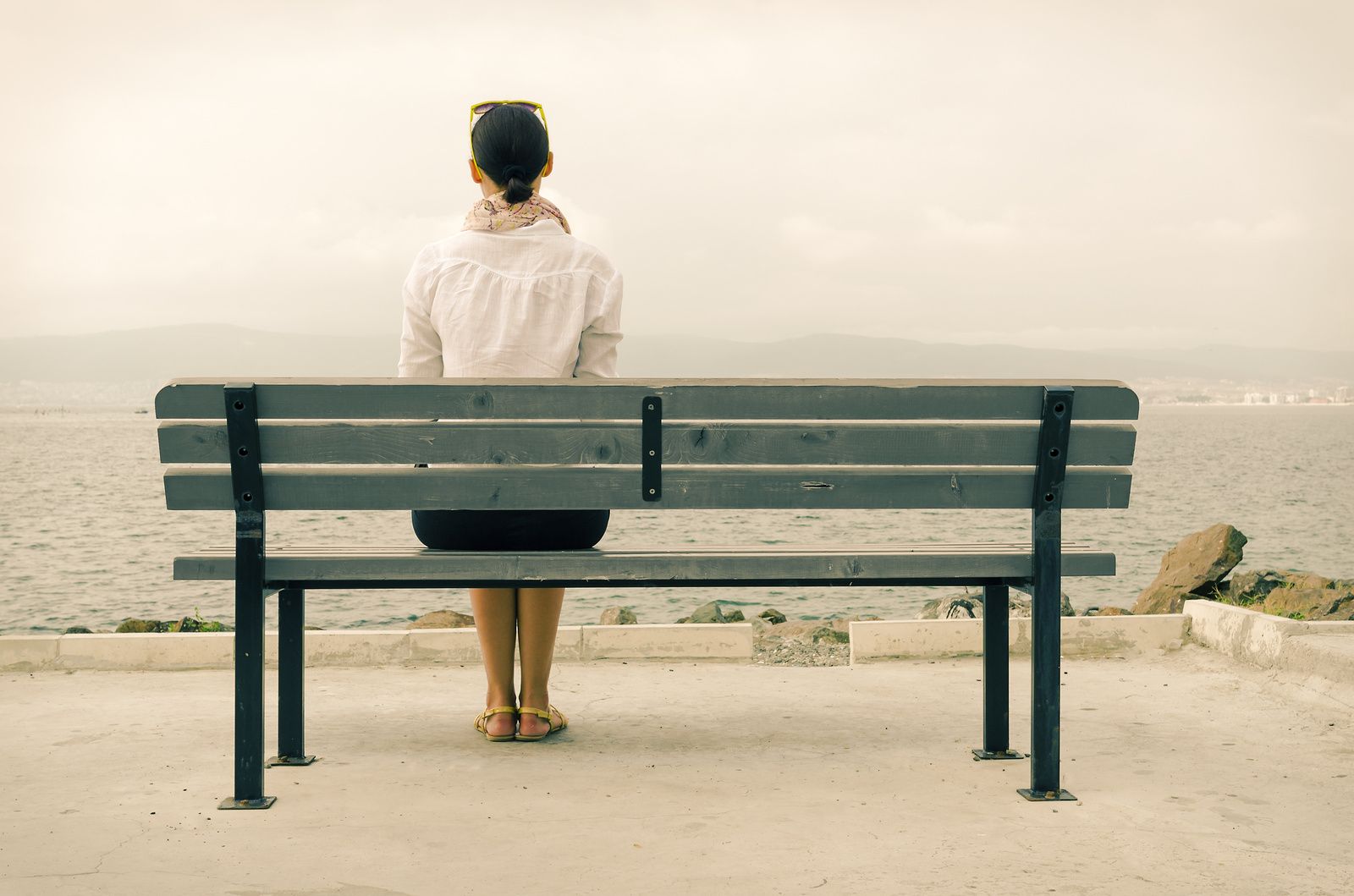 Woman sitting on bench SHE RECOVERS® Foundation