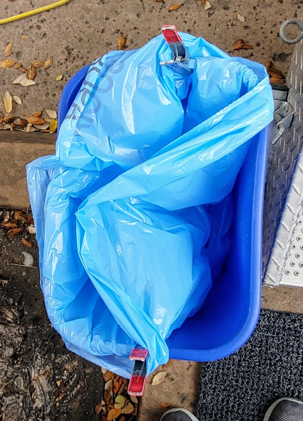 A tip on how to secure the blue bags in the blue bins Shower the