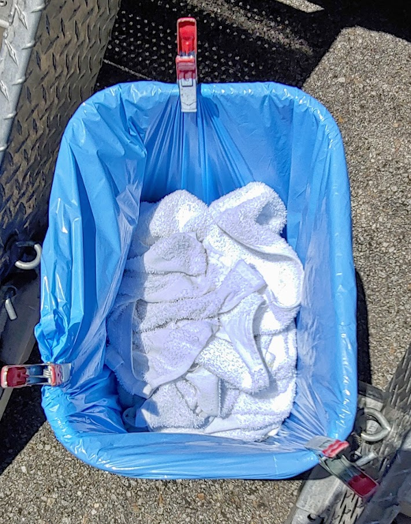 A tip on how to secure the blue bags in the blue bins Shower the