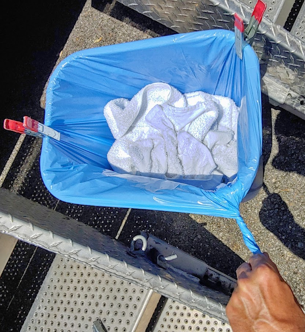 A tip on how to secure the blue bags in the blue bins Shower the