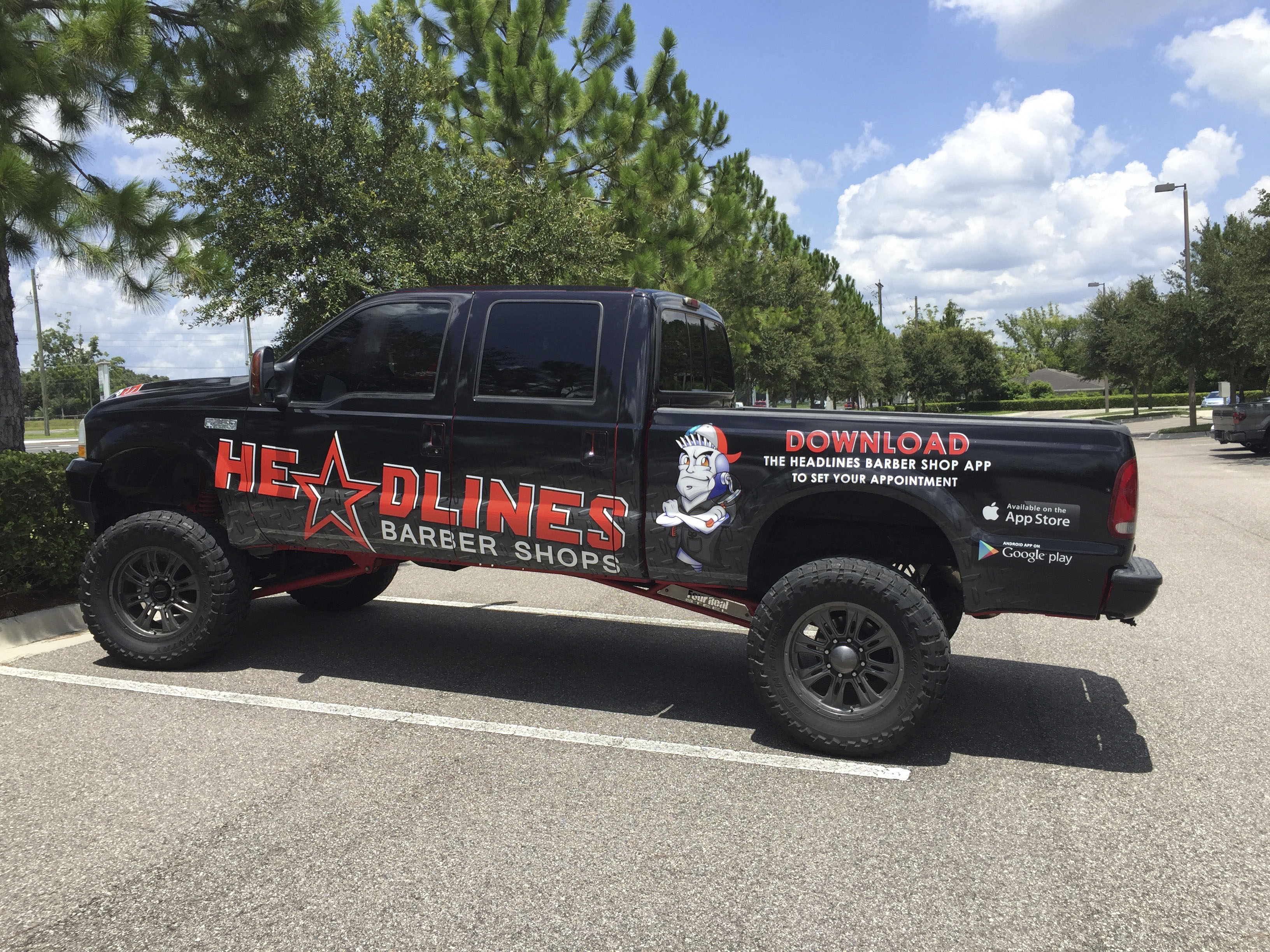 Tampa, FL Custom Truck Wrap on a Ford F250 for Headlines Hair Cuts