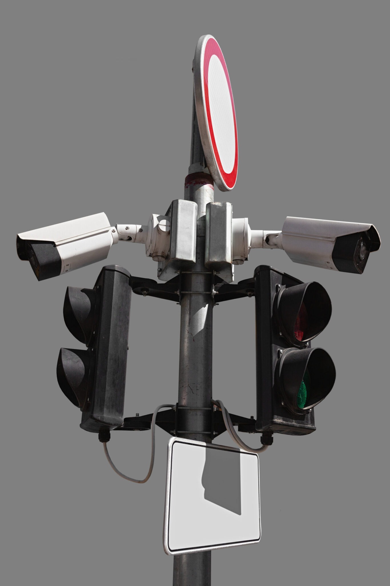 Traffic lights with surveillance cameras attached to the pole with