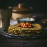 Methi thepla served with chundo on top and yogurt on the side