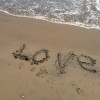 The word "love" written in the sand