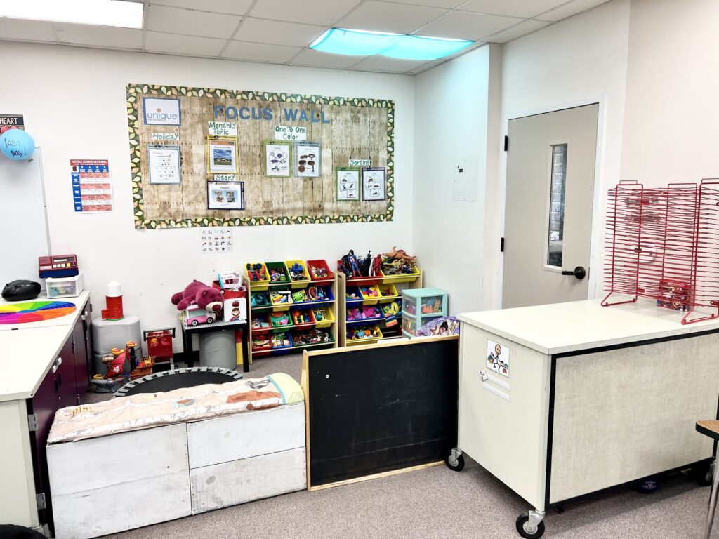 Play area with toys and trampoline.