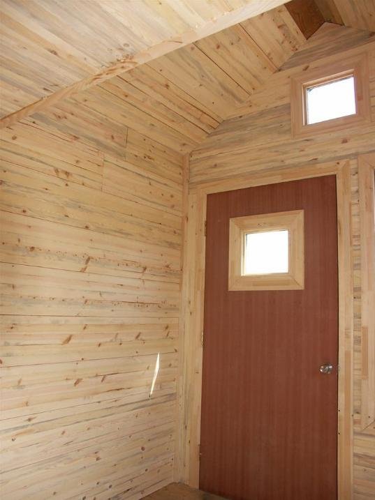 Tiny House Gallery Nonwarping patented wooden pivot door, sliding