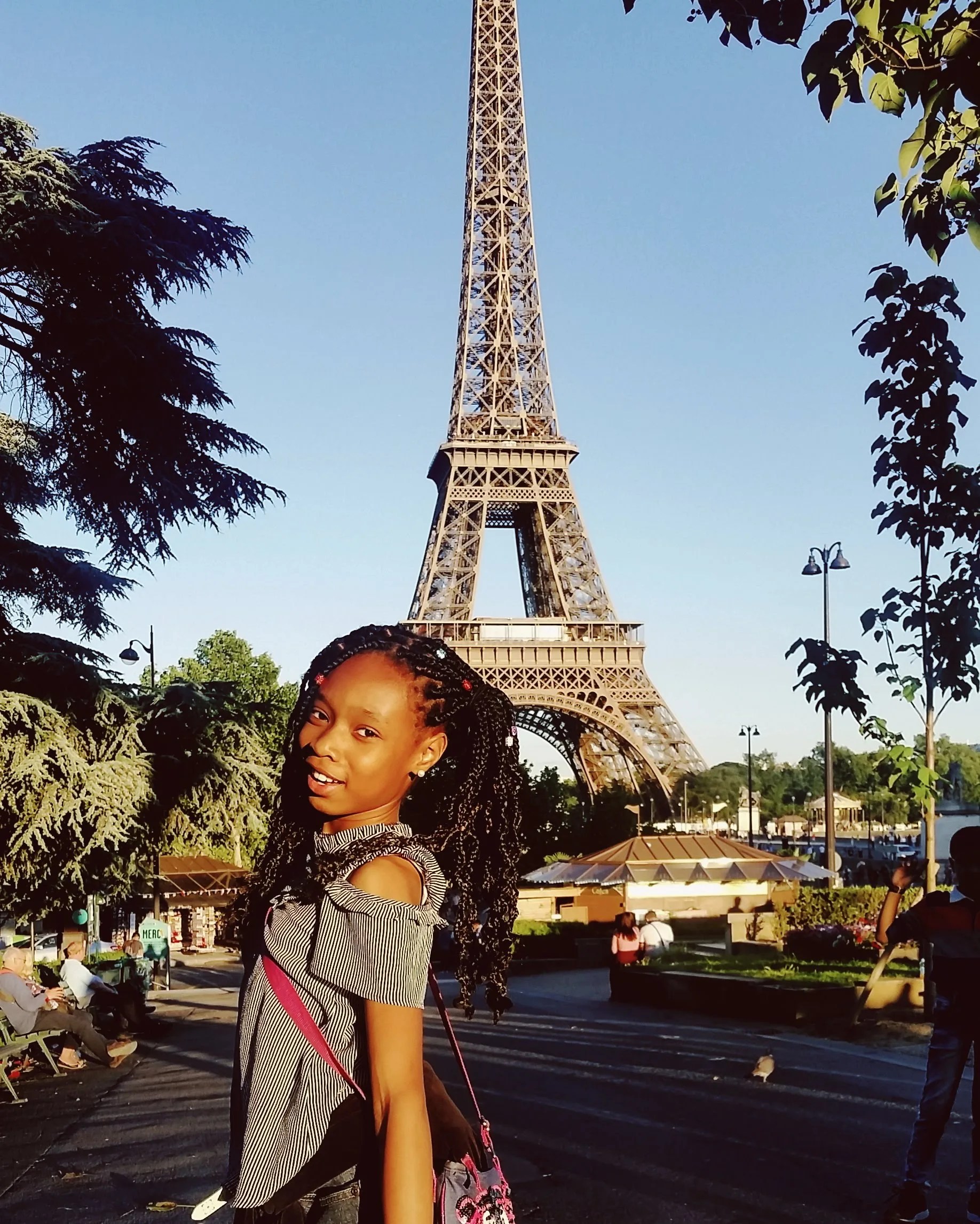 Our daughter in front of the Eiffel Tower