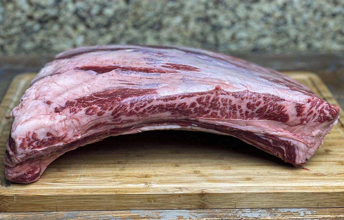 raw beef ribs on butcher block