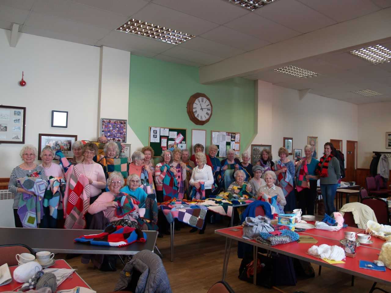 Shirley handcrafts group knits 100 blankets for young people with