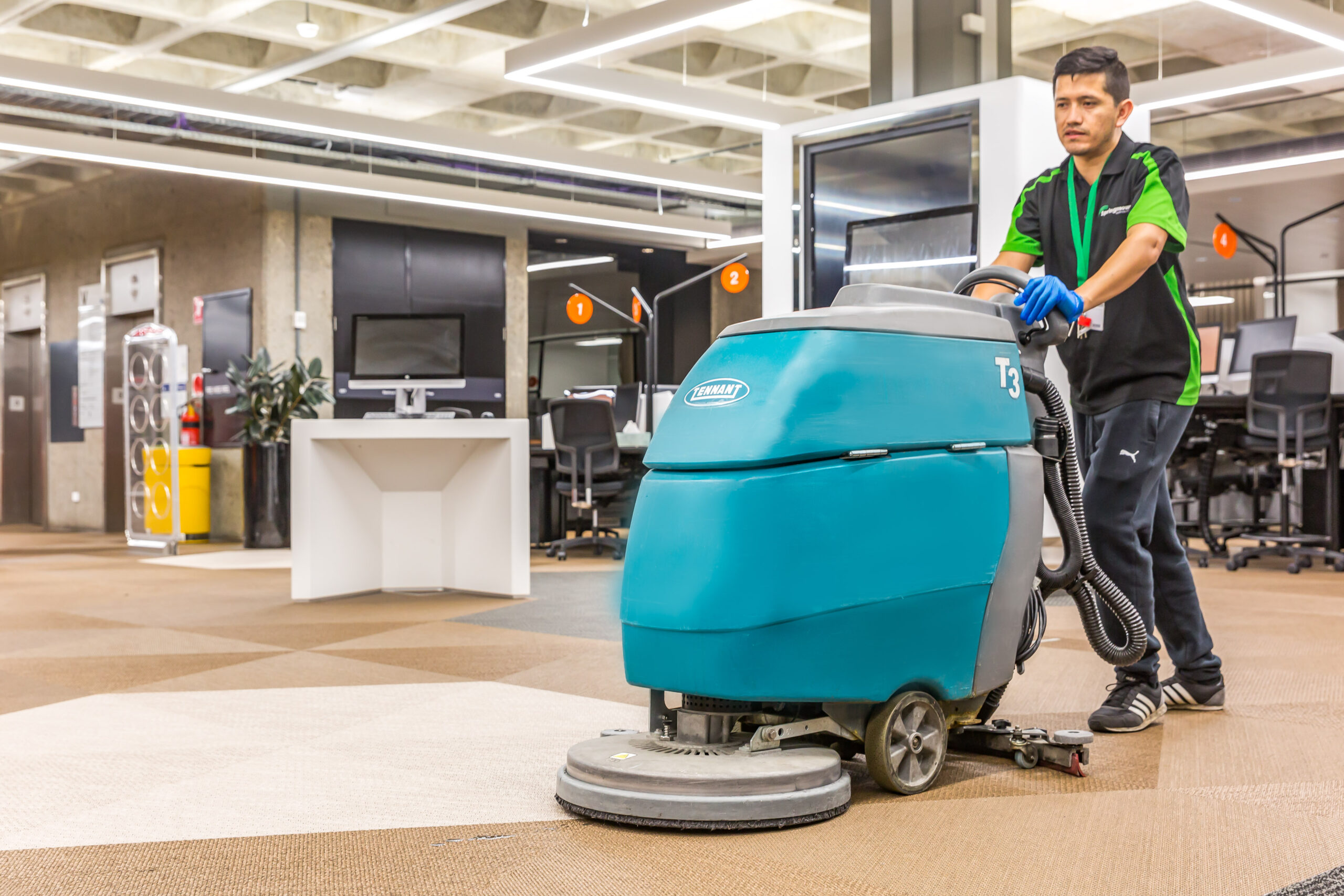 Man with scrubber at QUT inside Springmount Services Commercial