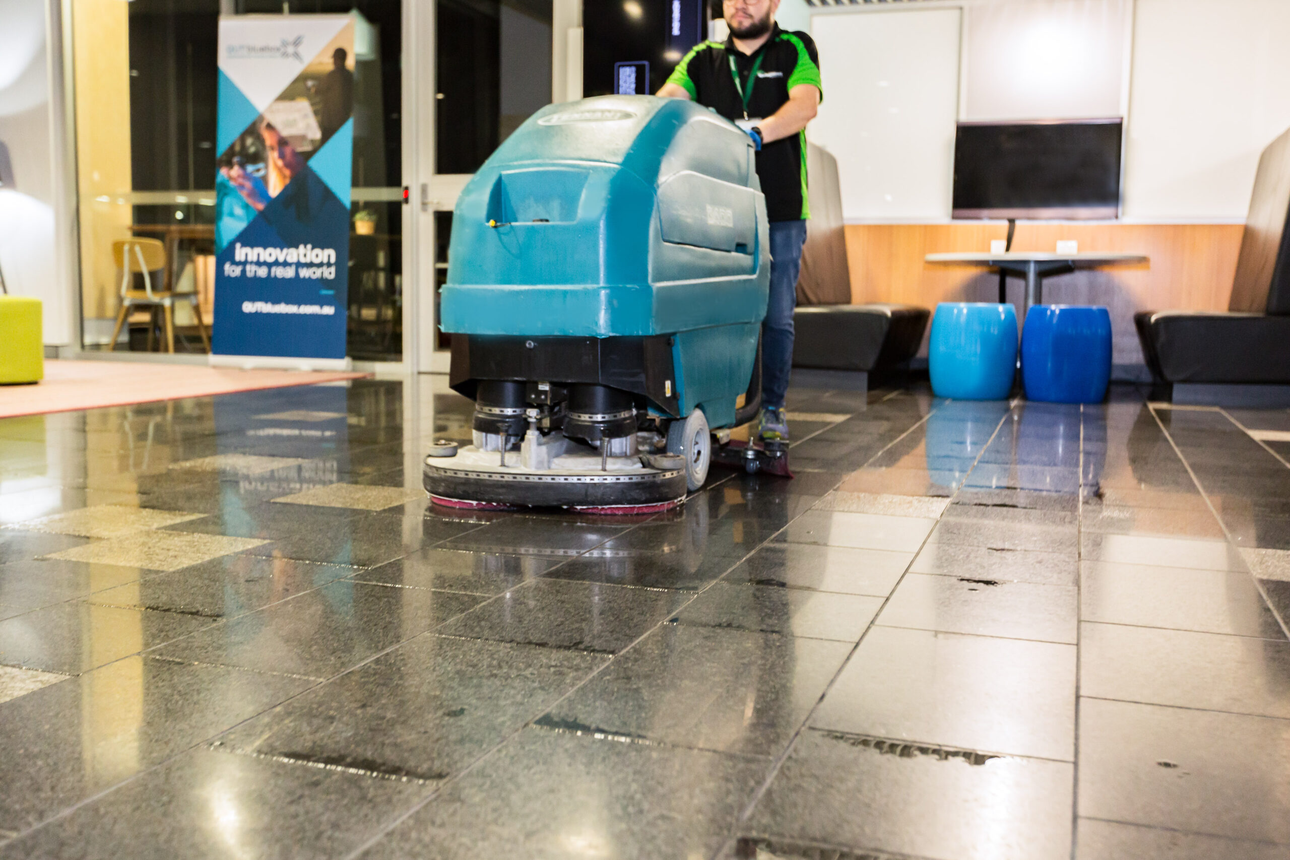 Front shot Man with scrubber at QUT Springmount Services Commercial
