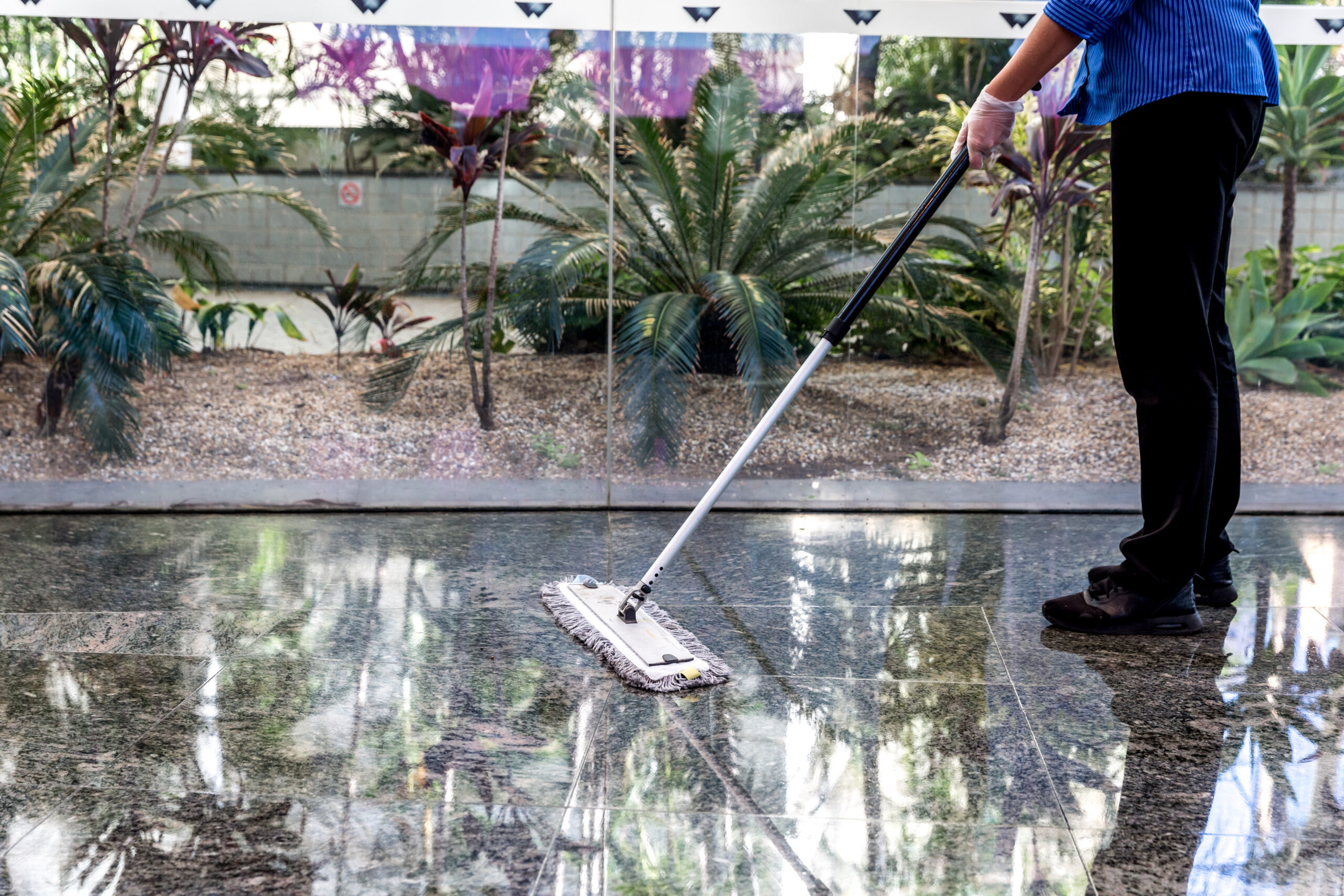 Female dry mopping in reception area Springmount Services