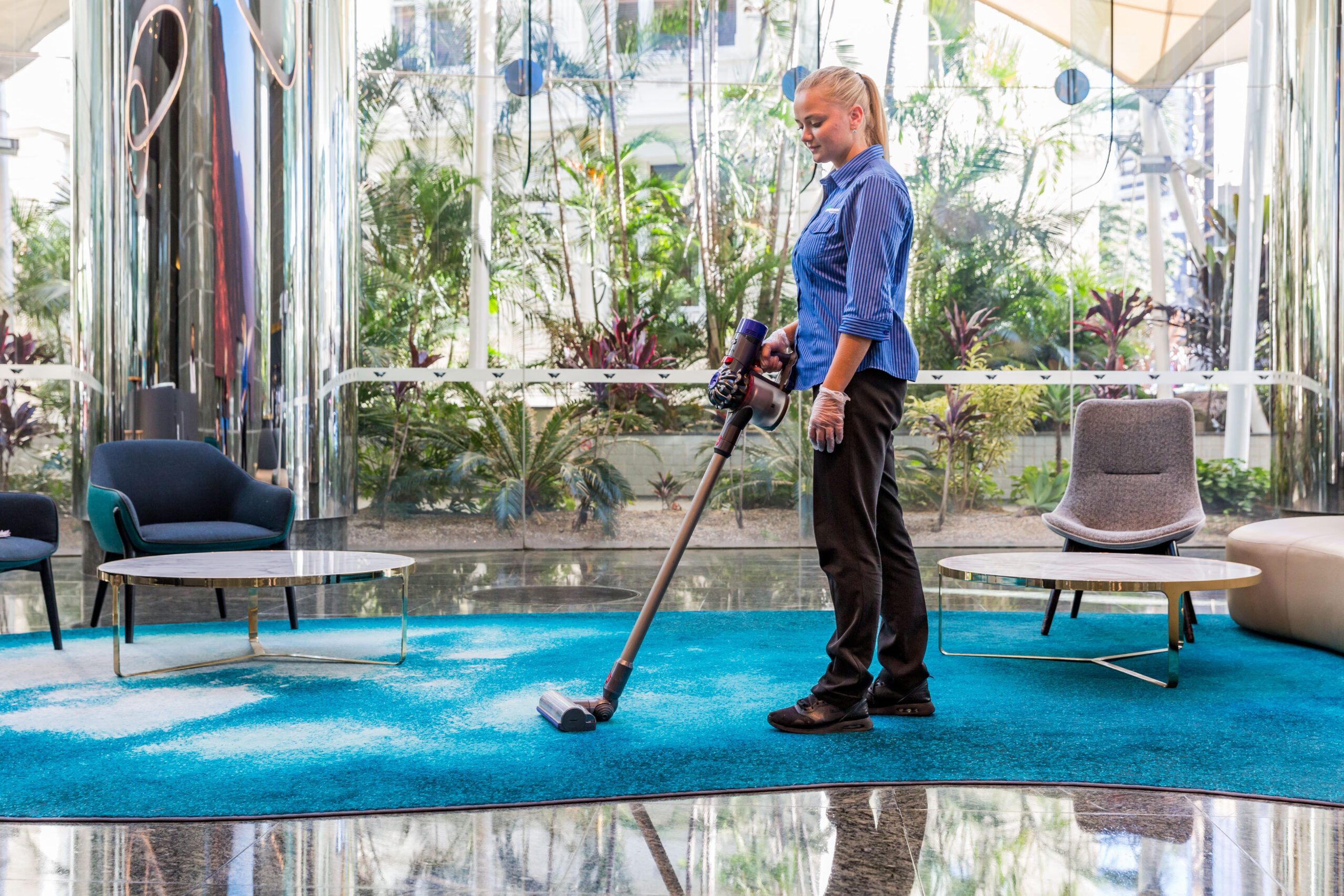 From Distance Female Vacuuming reception waiting area Springmount