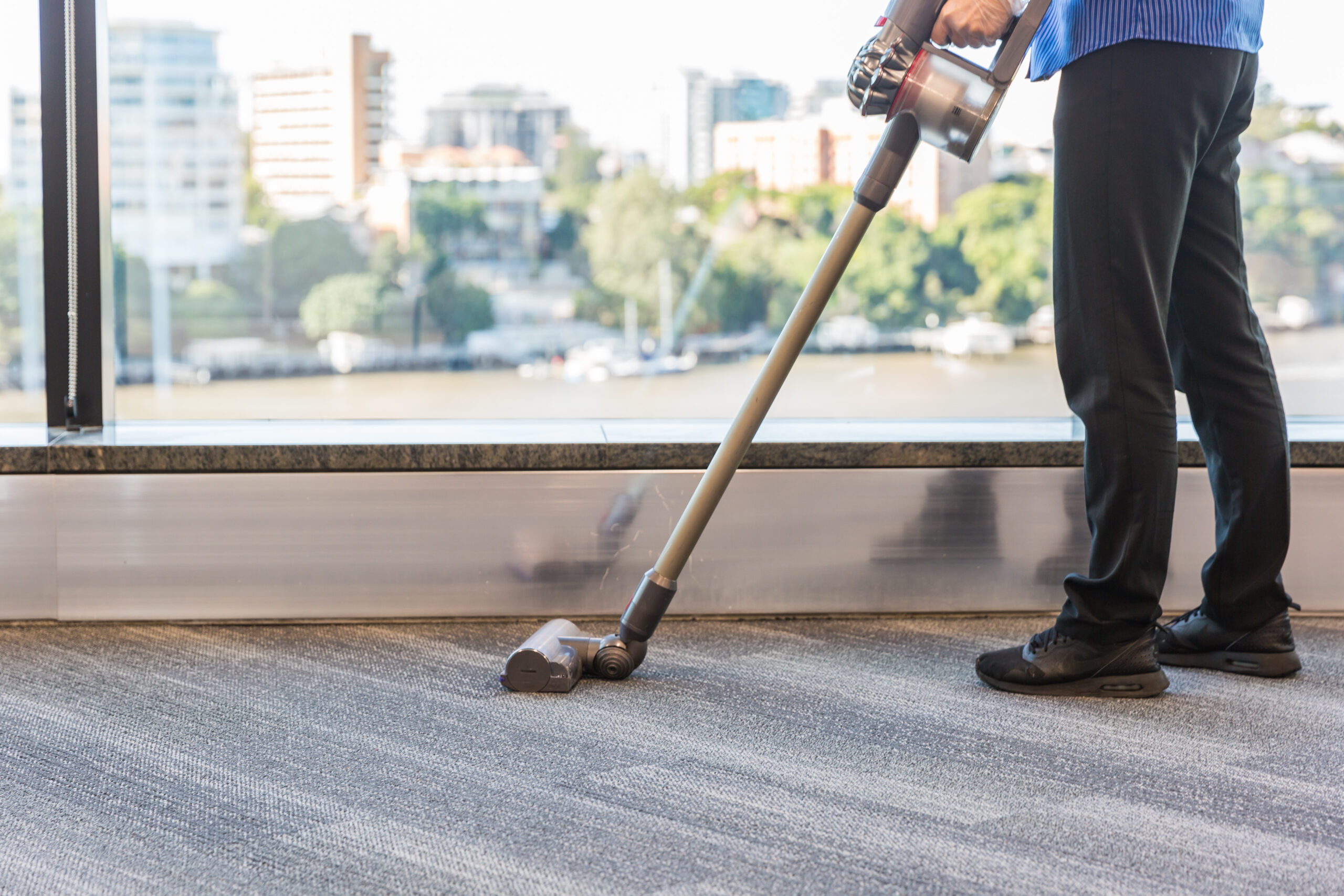 Female Vacuuming commercial building Springmount Services