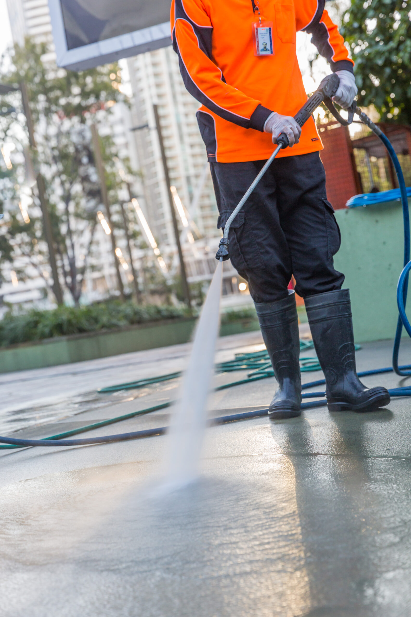 Hoses and Arts Precinct pressure cleaning machine operator