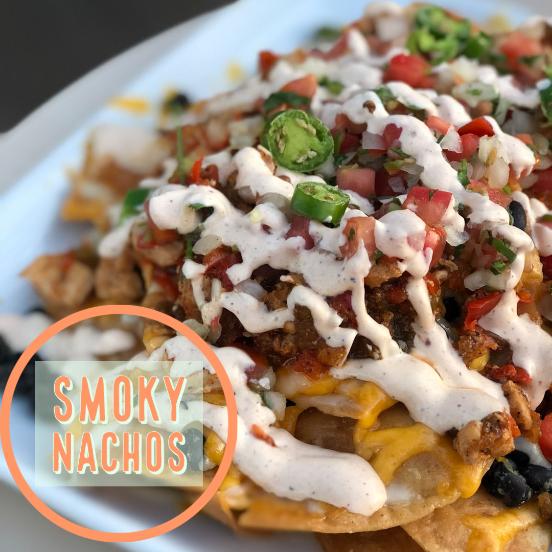 Smoky Sweet Potato Nachos bring together the flavors of smoked sweet potatoes, creamy guacamole and sour cream, beans, green onions & pickled jalapenos! For more recipes, health tips and travel posts be sure to follow me at www.sprouting-vitality.com and on instagram @sproutingvitality. #kenzinthekitch #mckenzieonthemove 