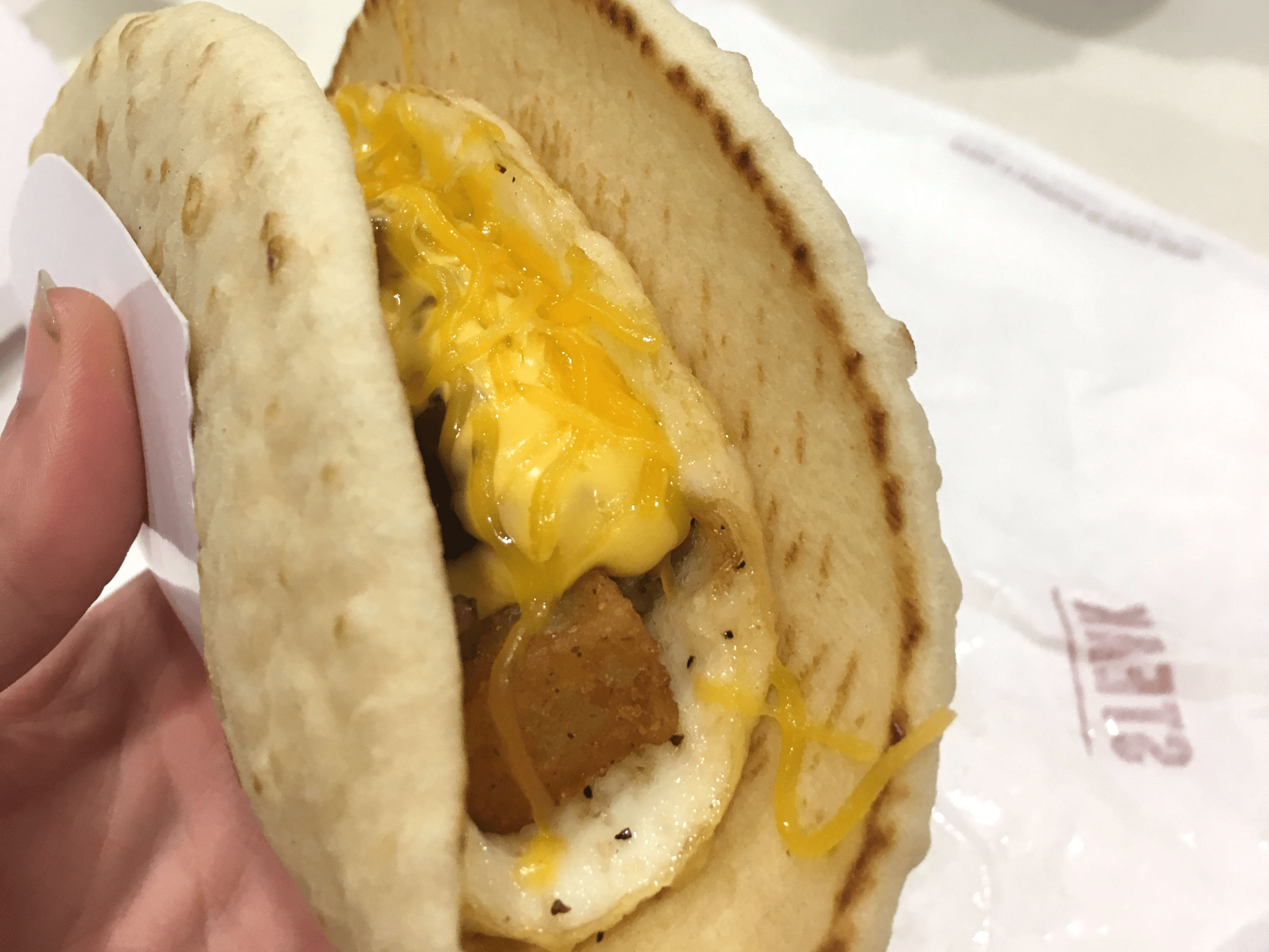 We tasted Taco Bell's new breakfast taco that uses a fried egg as the