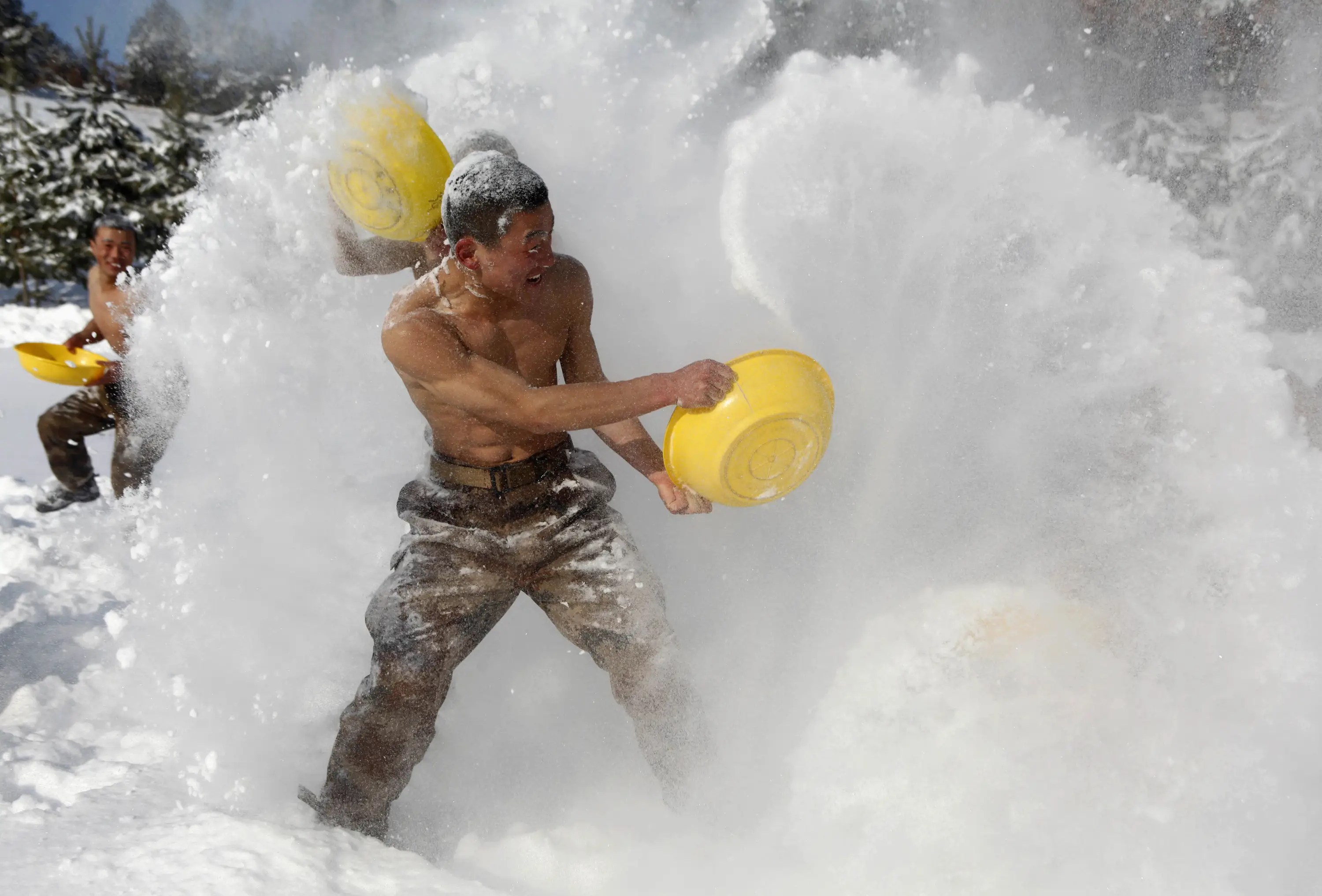 Chinese soldiers trained with swords in the snow near the country's