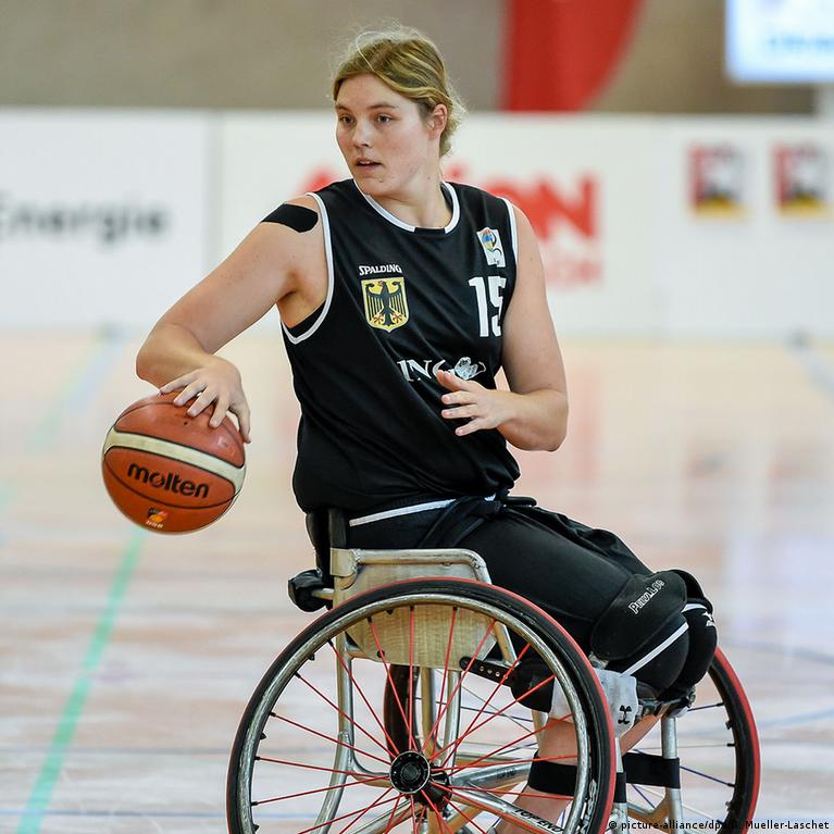 People In Wheelchairs Playing Basketball
