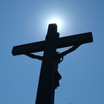 Sun peeking out behind Cross Statue in Mt. Olivet Cemetery- Detroit