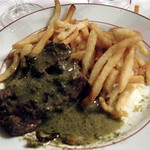 steak frites with mystery green pepper sauce, at le relais de l'entrec&ocirc;te