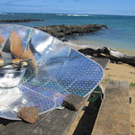 Solar funnel cooker with hot dogs
