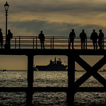 Illustrious watched by onlookers at the Round Tower and pier in old Portsmouth when she left the harbour for the final time.