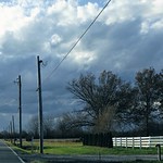 country road, snow clouds