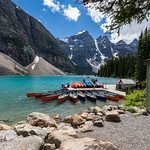 Alberta, Canada - July 9, 2022: Canoes at the boathouse on Morinae Lake in the summer in the Canadian Rockies