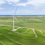 Modern Windmill Over Rolling Farmland
