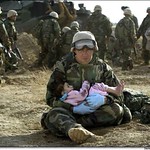 Soldier Helping Wounded Child