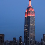 New York. The Empire State lights at dusk from wedding reception venue.