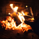 Whiskey glass with bonfire background