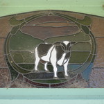 An Art Nouveau Stained Glass Window of the Royal Hotel Featuring a Fresian Cow &ndash; Smith Street, Loch