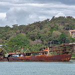 old ship still floating at the Jolly Roger Marina in Roatan