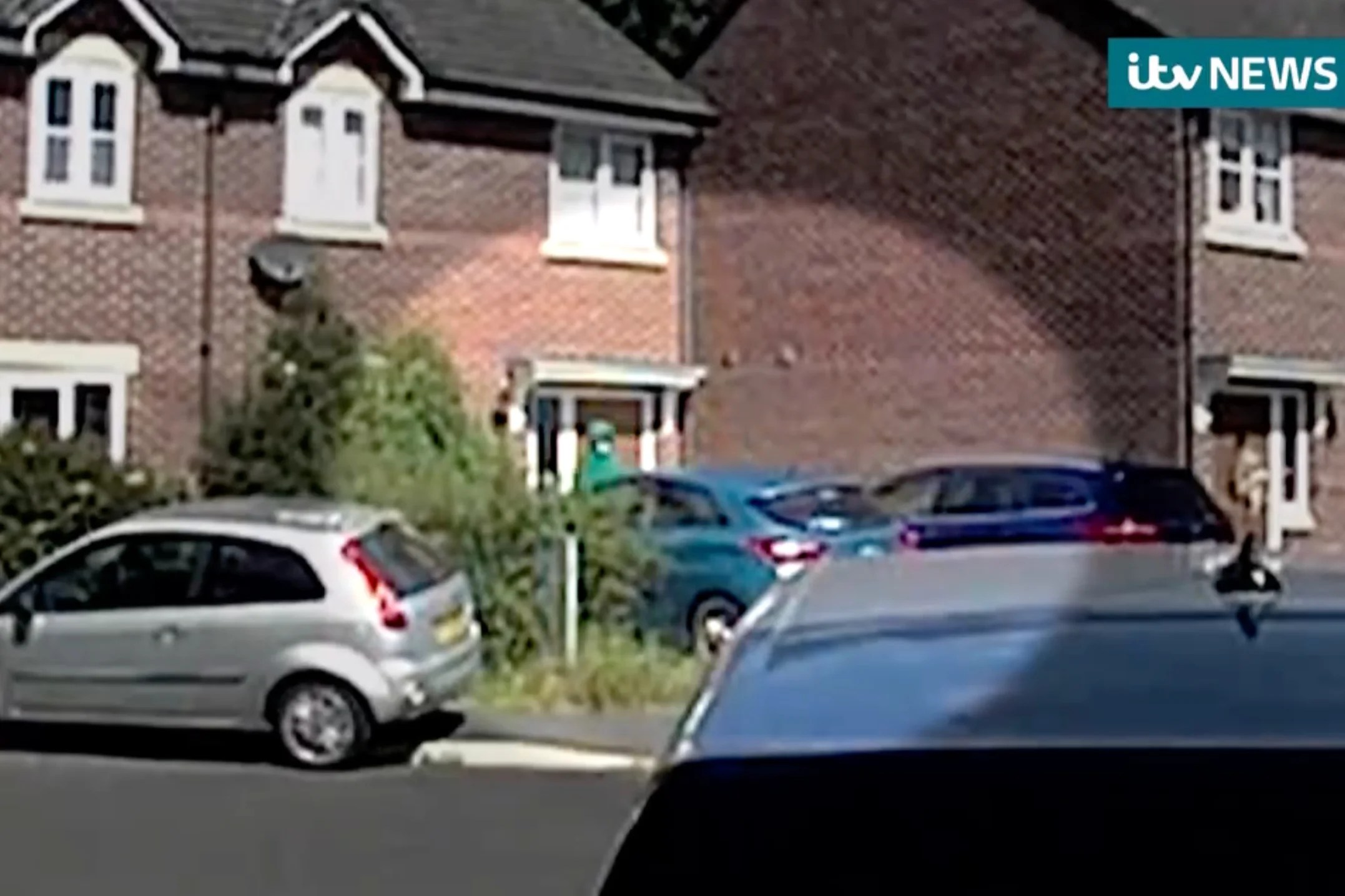 Video footage captures individual pacing outside residence targeted by armed police following stabbings in Southport.