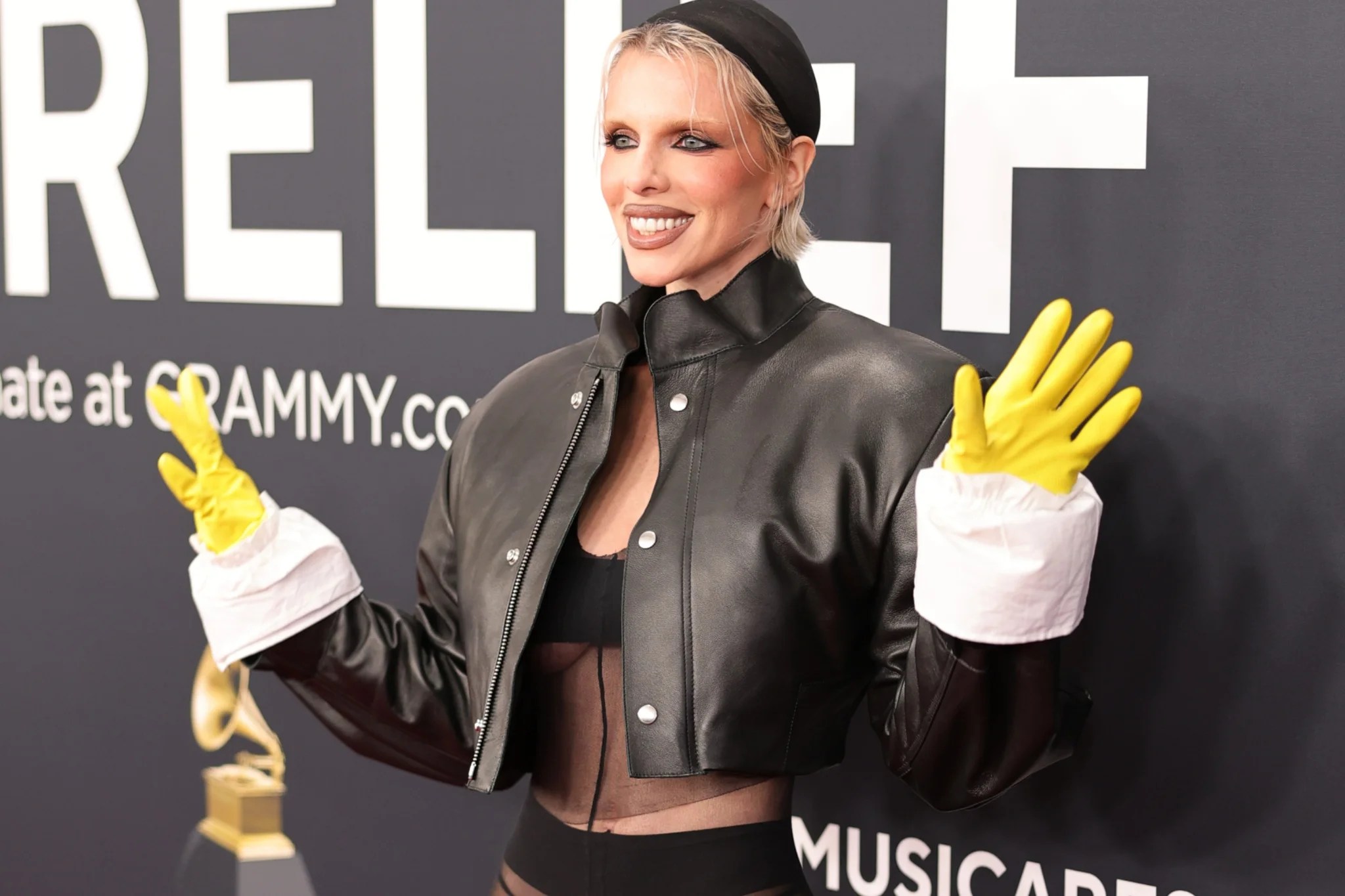 Julia Fox stuns Grammys red carpet with yellow kitchen gloves and sheer outfit
