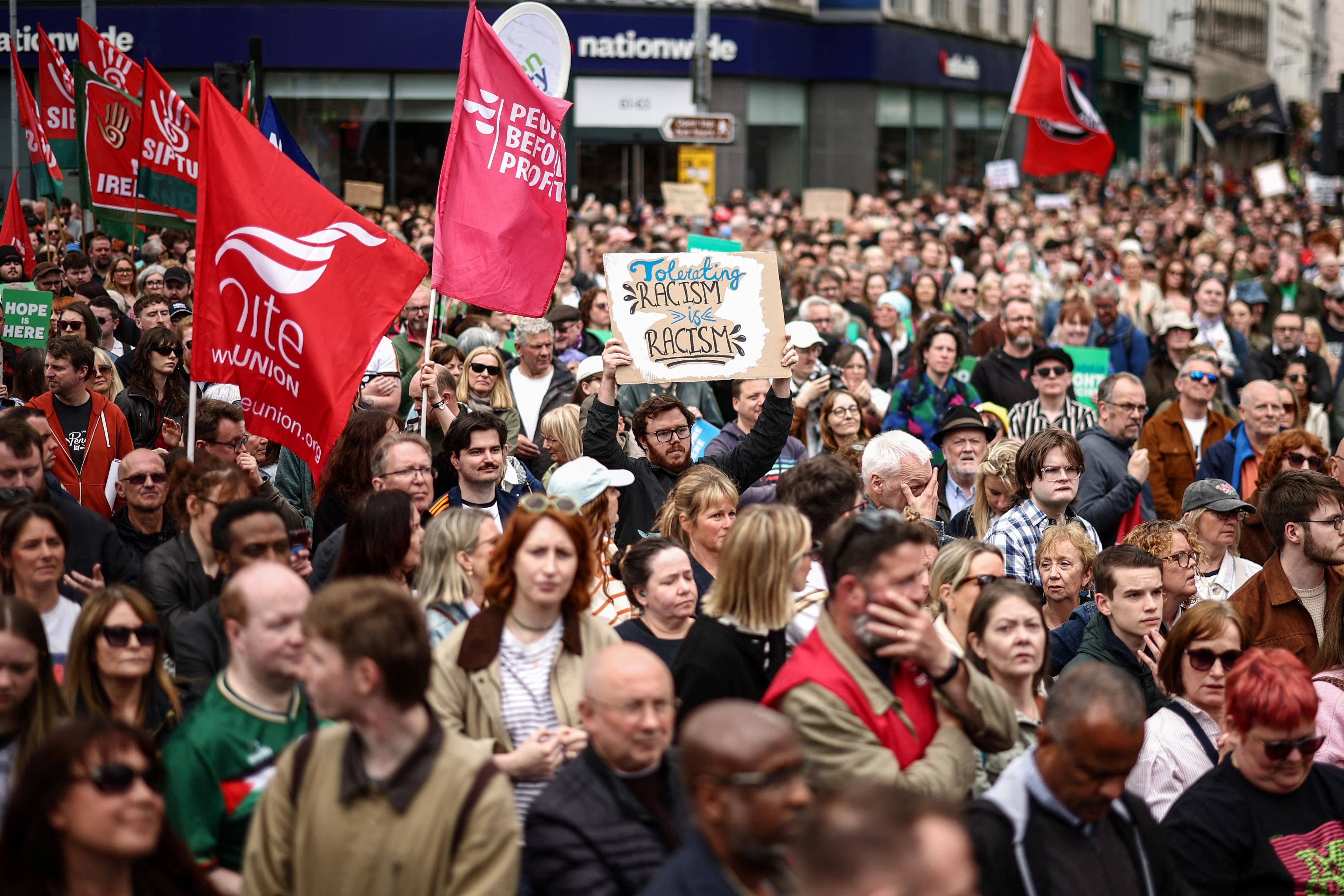Thousands attend Belfast anti-racism rally after days of violent protests