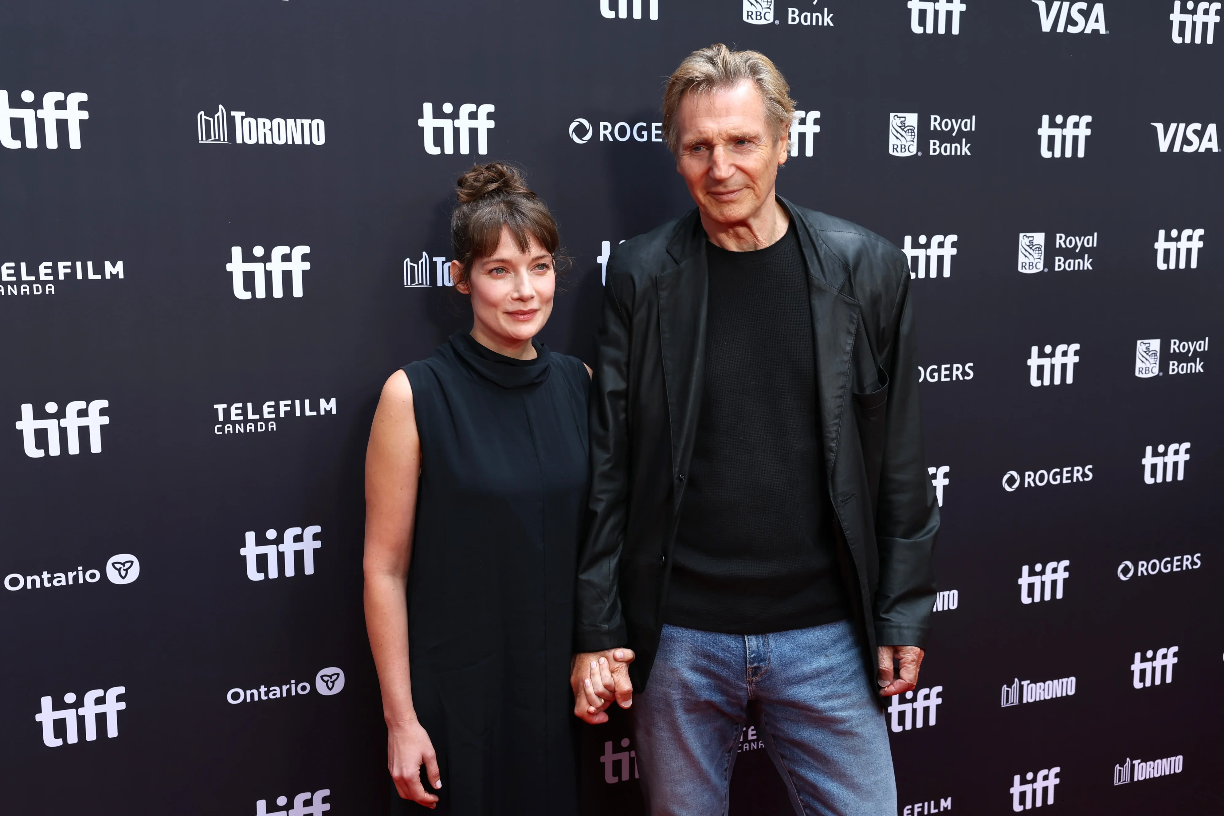 Liam Neeson sparks dating speculation after holding hands with co-star on the red carpet