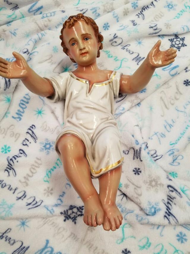 Baby Jesus figurine is back where it belongs on Christmas Day in front